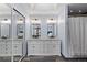 Bright bathroom with double sinks, granite countertop and wooden cabinets at 7975 S Gaylord Way, Centennial, CO 80122