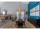 Bright dining room with high ceilings, area rug, and natural light at 7975 S Gaylord Way, Centennial, CO 80122