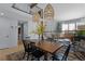 Open dining area with modern light fixtures and adjacent living space at 7975 S Gaylord Way, Centennial, CO 80122