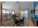 Bright dining room with high ceilings, area rug, and natural light at 7975 S Gaylord Way, Centennial, CO 80122