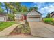 Inviting single Gathering home showcasing a well-kept lawn, solar panels, and a red front door at 7975 S Gaylord Way, Centennial, CO 80122