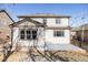 Exterior view of the home featuring a back patio at 21572 E Union Dr, Aurora, CO 80015