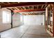 Unfinished basement with concrete floors, insulated walls, and exposed ceiling beams at 21572 E Union Dr, Aurora, CO 80015