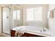 Bathroom with soaking tub and glass enclosed shower at 21572 E Union Dr, Aurora, CO 80015