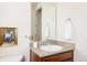 Bathroom vanity with granite countertop and framed floral art at 21572 E Union Dr, Aurora, CO 80015