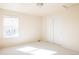 Bedroom featuring neutral walls, plush carpet, and a double door closet at 21572 E Union Dr, Aurora, CO 80015