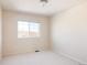 Bedroom featuring neutral walls, plush carpet, and a window at 21572 E Union Dr, Aurora, CO 80015