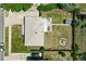 Aerial view of the property showcasing the roof, backyard with stone patio and covered area at 2714 S Raleigh St, Denver, CO 80236
