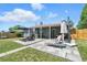 The backyard features both a covered patio and a stone patio, excellent for entertainment at 2714 S Raleigh St, Denver, CO 80236