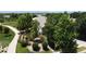 Aerial shot of a home nestled among mature trees and greenery, showcasing the expansive landscaping at 4932 Democrat Dr, Broomfield, CO 80023