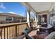 Backyard patio with outdoor seating, a decorative rug, and views of the lawn and house exterior at 4932 Democrat Dr, Broomfield, CO 80023