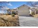 Charming single Gathering home with stone accents, manicured lawn, and a two-car garage at 4932 Democrat Dr, Broomfield, CO 80023