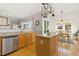 Bright kitchen with stainless steel appliances, an island, and a cozy breakfast nook at 4932 Democrat Dr, Broomfield, CO 80023