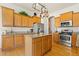Well-equipped kitchen boasts stainless steel appliances, granite countertops, and an island at 4932 Democrat Dr, Broomfield, CO 80023