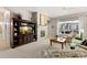 Cozy living room with fireplace, large window, and comfortable seating furniture at 4932 Democrat Dr, Broomfield, CO 80023