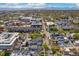 An aerial view showing the community, local businesses and the mountains in the distance at 1832 W 33Rd Ave, Denver, CO 80211