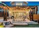 Charming backyard patio with pergola and string lights, perfect for outdoor entertaining and relaxation at 1832 W 33Rd Ave, Denver, CO 80211