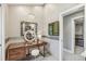 Vanity area featuring chandelier lighting, vanity, stool, and doorway to the walk-in closet at 1832 W 33Rd Ave, Denver, CO 80211