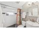 Bathroom boasts subway tile in shower with a colorful shower curtain and modern fixtures at 1832 W 33Rd Ave, Denver, CO 80211