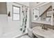 Bright bathroom with tub and shower featuring a leafy shower curtain at 1832 W 33Rd Ave, Denver, CO 80211