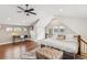 Bright bedroom boasts hardwood floors, a vaulted ceiling, desk area, and a comfortable bed at 1832 W 33Rd Ave, Denver, CO 80211
