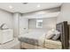 Basement bedroom with closet, bed, dresser, and window with natural light at 1832 W 33Rd Ave, Denver, CO 80211
