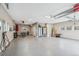 Spacious garage with epoxy floors, ample storage, and an electric car charging station at 1832 W 33Rd Ave, Denver, CO 80211