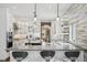 Bright, modern kitchen featuring stainless steel appliances, pendant lighting, and a large island with seating at 1832 W 33Rd Ave, Denver, CO 80211