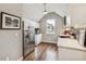 Bright kitchen features stainless steel appliances, hardwood floors, and a window view at 1832 W 33Rd Ave, Denver, CO 80211