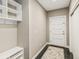 Convenient mudroom with built-in storage, hooks, and a stylish rug for easy organization at 1832 W 33Rd Ave, Denver, CO 80211