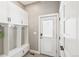 Mudroom features built in cubbies with storage and a patterned tile floor at 1832 W 33Rd Ave, Denver, CO 80211