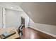 Office space featuring hardwood floors and a unique slanted ceiling at 1832 W 33Rd Ave, Denver, CO 80211