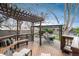 Beautiful backyard with a wooden deck, pergola, gazebo, and serene rock garden feature at 1585 W Briarwood Ave, Littleton, CO 80120