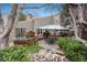Backyard featuring a pond, patio, gazebo and mature landscaping at 1585 W Briarwood Ave, Littleton, CO 80120