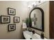 Stylish bathroom features a modern vanity, decorative mirror, and elegant fixtures at 1585 W Briarwood Ave, Littleton, CO 80120