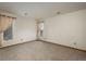 Spacious bedroom with neutral carpeting, two windows, and a calming ambiance at 1585 W Briarwood Ave, Littleton, CO 80120
