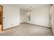 Bright bedroom with soft carpeting, a window, and an adjacent closet at 1585 W Briarwood Ave, Littleton, CO 80120