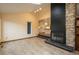Open-concept living room boasts a stone fireplace, tiled flooring, and bright natural light at 1585 W Briarwood Ave, Littleton, CO 80120