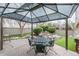 Charming patio with stone flooring, complemented by a covered gazebo and lush landscaping at 1585 W Briarwood Ave, Littleton, CO 80120