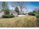 Well-maintained backyard with a combination of lawn, landscaping, and outdoor living space at 1585 W Briarwood Ave, Littleton, CO 80120