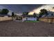 Expansive backyard featuring a covered patio area with an outdoor dining set and a fenced perimeter at 40 Benton St, Lakewood, CO 80226