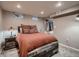Cozy bedroom with stylish decor, natural light, and comfortable furnishings, creating a relaxing and inviting space at 40 Benton St, Lakewood, CO 80226