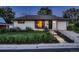 Charming single-story home with manicured lawn and flower beds. Features include attached garage and inviting entryway at 40 Benton St, Lakewood, CO 80226