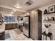Spacious kitchen with stainless steel appliances, ample storage, and neutral color scheme at 40 Benton St, Lakewood, CO 80226