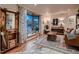 Inviting living room with hardwood floors, bay window, and tastefully decorated interior at 40 Benton St, Lakewood, CO 80226