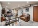 Cozy living room with leather furniture, recessed lighting, and a geometric rug that brings the room together at 40 Benton St, Lakewood, CO 80226
