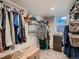 Spacious walk-in closet with ample storage space and natural light coming from the window at 40 Benton St, Lakewood, CO 80226