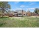 Expansive backyard features a spacious deck, perfect for outdoor entertaining and relaxation on sunny days at 5603 S Pagosa Ct, Centennial, CO 80015