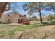 Spacious backyard featuring mature trees, lawn, and a deck and patio space at 5603 S Pagosa Ct, Centennial, CO 80015