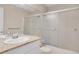 Bathroom featuring granite counters, a sink, toilet, and shower with a glass enclosure at 5603 S Pagosa Ct, Centennial, CO 80015